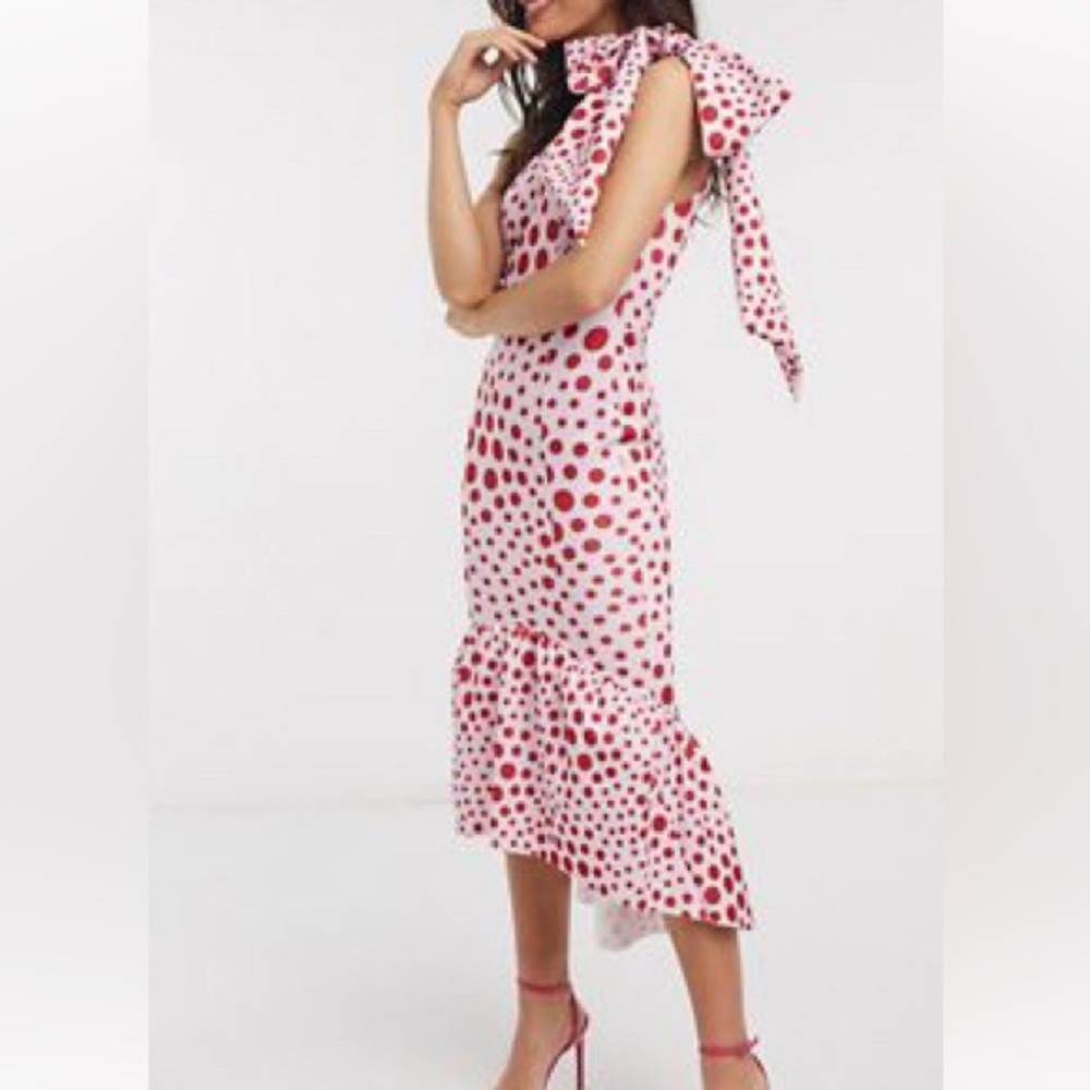 Beautiful dress! Never worn. Tight fit.